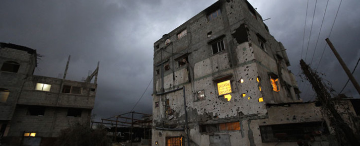 A destroyed Palestinian house on a rainy day in Al-Shejaeiya neighbourhood in the east of Gaza City, 19 October 2014. Picture: EPA.