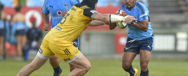 FILE: Bulls scrumhalf Rudy Paige (right) looks to get past Hurricanes prop Jeffery Toomaga-Allen in their 2017 Super Rugby match. Picture: AFP