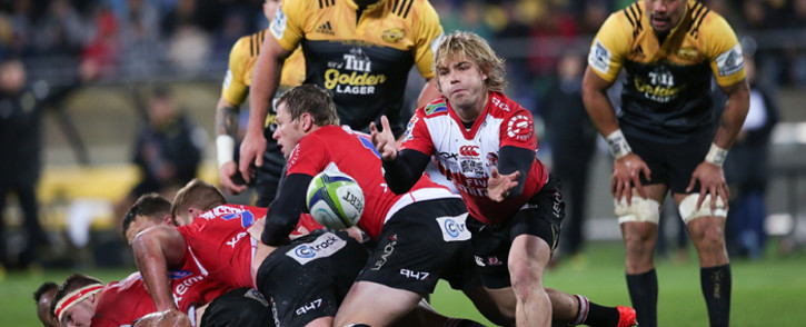 Faf de Klerk of the Lions (2nd R) passes from a ruck during the Super Rugby final match between the Wellington Hurricanes and Lions of South Africa at Westpac Stadium in Wellington on 6 August, 2016. Picture: AFP.
