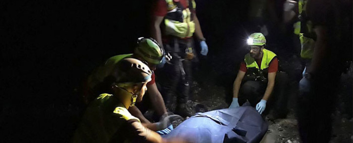 Rescuers recover a body as they continue their search for possible survivors of deadly flash flooding in the Raganello river, a popular hiking spot in Civita, in the Calabria region's Pollino national park, late on 20 August 2018. Picture: AFP