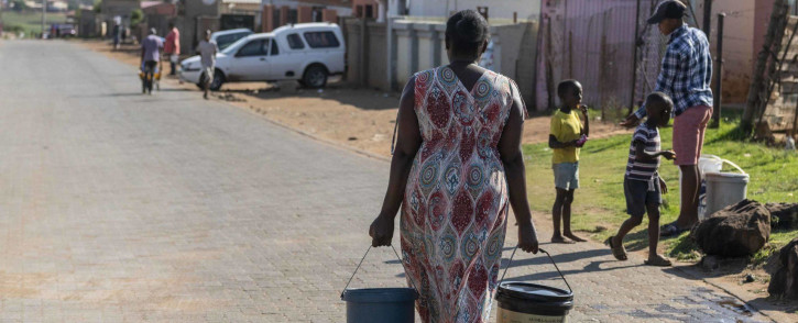 A resident of Barcelona in Etwatwa, Ekurhuleni, shuns voting in order to get water after going without it for days.
