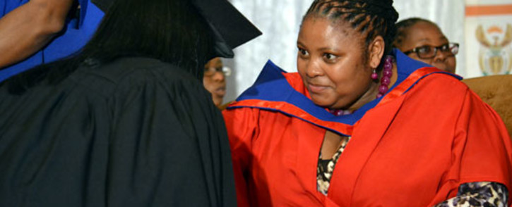 Correctional Services Minister Nosiviwe Mapisa-Nqakula and convicted murderer Dina Rodriguez during the ceremony for graduates who obtained an e-literacy certificate at Pollsmoor on 14 May 2012. Picture: Aletta Gardner/EWN
