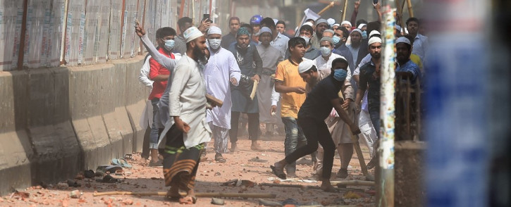 Activists from Islamist groups clash with the police as they protest against the visit of Indian Prime Minister Narendra Modi in Dhaka on 26 March 2021. Picture: Munir Uz zaman/AFP