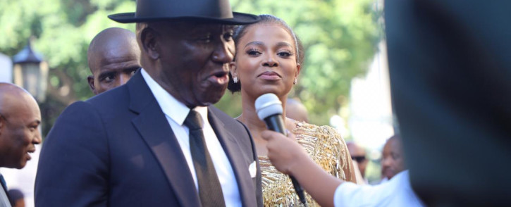 Police Minister Bheki Cele and his wife Thembeka Ngcobo on the red carpet outside Parliament for the 2020 State of the Nation Address. Picture: Kayleen Morgan/EWN
