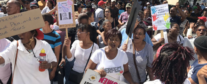 Community members protest outside the Goodwood magistrates court on 21 February 2020 where the man accused of murdering Tazne van Wyk (8) appear. Picture: Lauren Isaacs/EWN