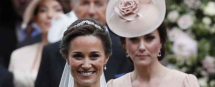 Britain's Catherine, Duchess of Cambridge, follows her sister Pippa Middleton after her wedding to James Matthews on 20 May 2017. Picture: AFP.