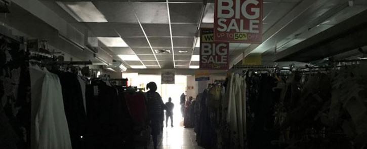 FILE: A clothing store in Claremont, Cape Town, in darkness as load shedding kicks in. Picture: Kaylynn Palm/Eyewitness News.