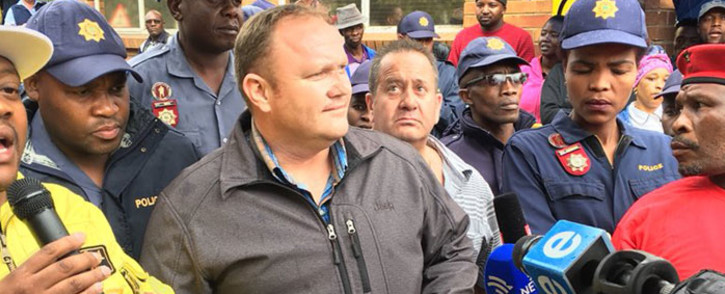 George van der Merwe, chief operating officer at the Optimum Mine receives a memorandum of demands from workers at the mine on 22 February 2018. Picture: Pelane Phakgadi/EWN