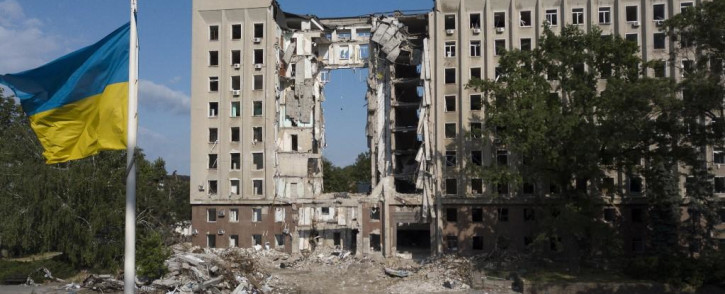 This photograph taken on 10 June 2022, shows the regional government building destroyed by a Russian missile strike in March 2022, in the southern Ukrainian city of Mykolaiv, amid the Russian invasion of Ukraine. Credit: AFP