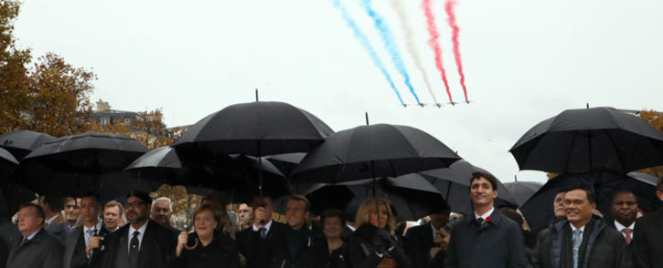 (From left) Denmark's Prime Minister Lars Lokke Rasmussen, Morocco's Prince Moulay Hassan, Moroccan King Mohammed VI, German Chancellor Angela Merkel, French President Emmanuel Macron and his wife Brigitte Macron and Canadian Prime Minister Justin Trudeau arrive at the Arc de Triomphe in Paris on 11 November 2018 to attend a ceremony as part of Armistice Day. Picture: AFP