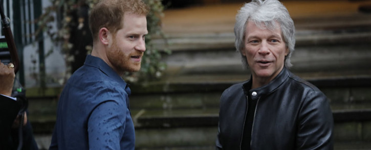 Britain's Prince Harry, Duke of Sussex, chats with US singer Jon Bon Jovi as he arrives at Abbey Road Studios in London on February 28, 2020, where they met with members of the Invictus Games Choir, who were there to record a special single in aid of the Invictus Games Foundation. Picture: AFP.