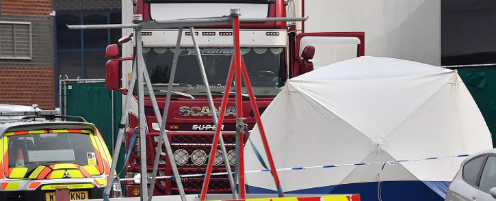 A lorry, believed to have originated from Bulgaria, and found to be containing 39 dead bodies, is pictured inside a Police cordon at Waterglade Industrial Park in Grays, east of London, on 23 October 2019. Picture: AFP