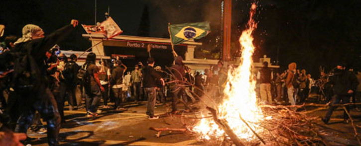 Students light a bonfire during a protest in front of the Government Palace, in Sao Paulo, Brazil on June 17, 2013. Picture: AFP.
