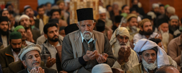 Devotees pray during a Friday prayer at a mosque in Rawalpindi on 10 December 2021. Picture: AFP
