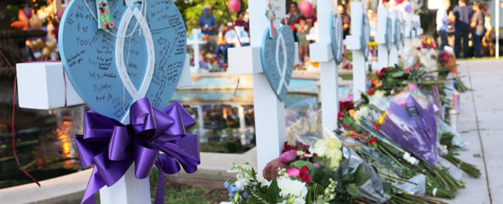 Memorials for victims of Tuesday's mass shooting at a Texas elementary school, in City of Uvalde Town Square on 26 May 2022 in Uvalde, Texas. Nineteen children and two adults were killed at Robb Elementary School after a man entered the school through an unlocked door and barricaded himself in a classroom where the victims were located. Picture: Michael M. Santiago/Getty Images/AFP