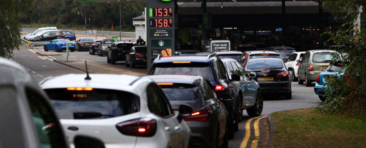 Motorists queue for petrol and diesel fuel at a petrol station off of the M3 motorway near Fleet, west of London on 26 September 2021. Picture: Adrian Dennis/AFP