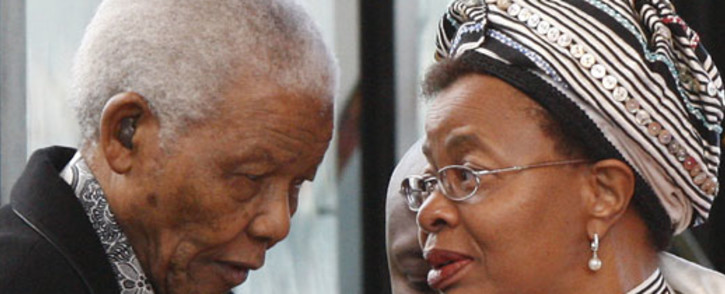 Nelson Mandela is aided by his wife, Graca Machel in 2009. Picture: AFP