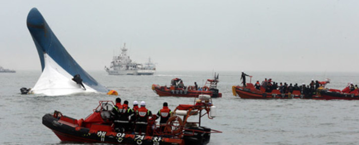 South Korea Coast Guard members searching for passengers near a South Korean ferry after it capsized on its way to Jeju island from Incheon on 16 April 2014. Picture: AFP