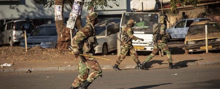 FILE: Army officials patrolled the streets during election protests in Zimbabwe on 1 August 2018. Picture: Thomas Holder/EWN