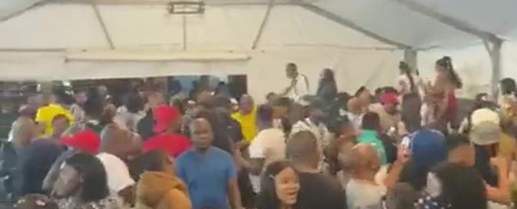 In the video, revellers at an East London venue can be seen downing liquor while maintaining close contact. Picture: Screenshot