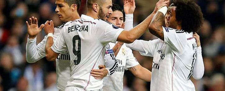 Real Madrid's Karim Benzema celebrates with Ronaldo (L) and Marcelo (R) after scoring a goal against Liverpool on 4 November 2014. Picture: Real Madrid Facebook page.