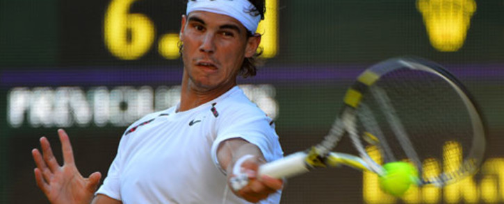 Spain's Rafael Nadal plays a forehand shot during his second round men's singles match against Czech Republic's Lukas Rosol at the 2012 Wimbledon Championships on 28 June, 2012. Picture: AFP