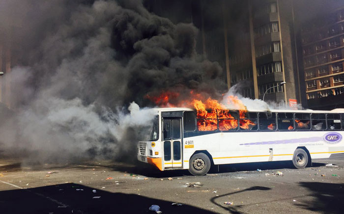 A bus has been set alight during Fess Must Fall protests as Wits students continue protesting. Picture: Ziyanda Ngcobo/EWN."