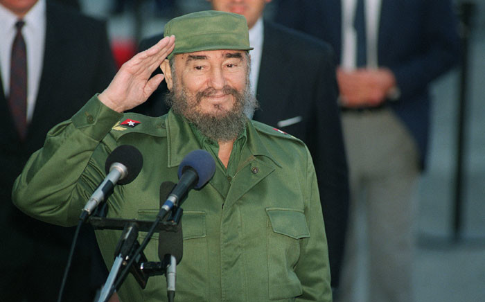 This file photo taken on 12 October 1995 shows Cuban President Fidel Castro saluting journalists. Picture: AFP.