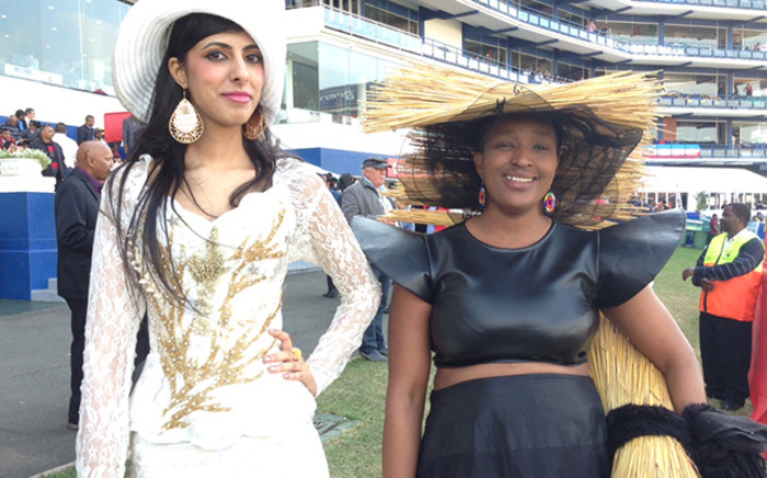 The woman with a straw hat and bag says her Durban July outfit was inspired by the thatched roofing of Nkandla, Picture: Vumani Mkhize/EWN."