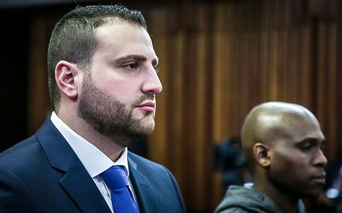 Christopher Panayiotou and co-accused Sinethemba Nenembe stand in the PE High Court to hear the charges against them. Picture: Anthony Molyneaux/EWN