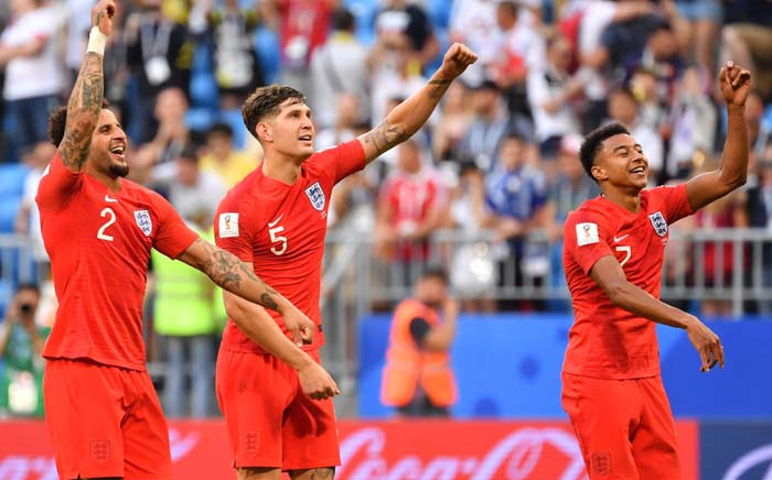 (L to R) England's defender Kyle Walker, England's defender John Stones and England's midfielder Jesse Lingard celebrate at the end of the Russia 2018 World Cup quarter-final football match between Sweden and England. Picture: AFP