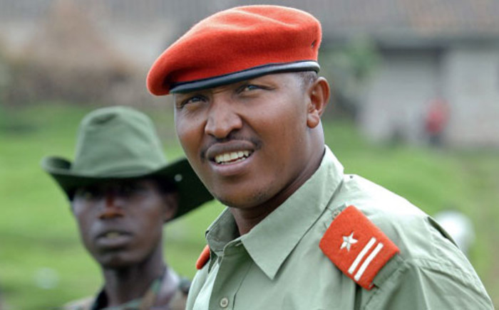 A picture taken on January 11, 2009 shows rebel General Bosco Ntaganda, self declared leader of the CNDP, escorted by comrades at his mountain base in Kabati. Picture: AFP