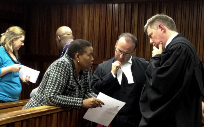 IEC Chair Pansy Tlakula confers with her legal team at the Electoral Court during a hearing into her credibility, 4 June 2014. Picture: Govan Whittles/EWN.