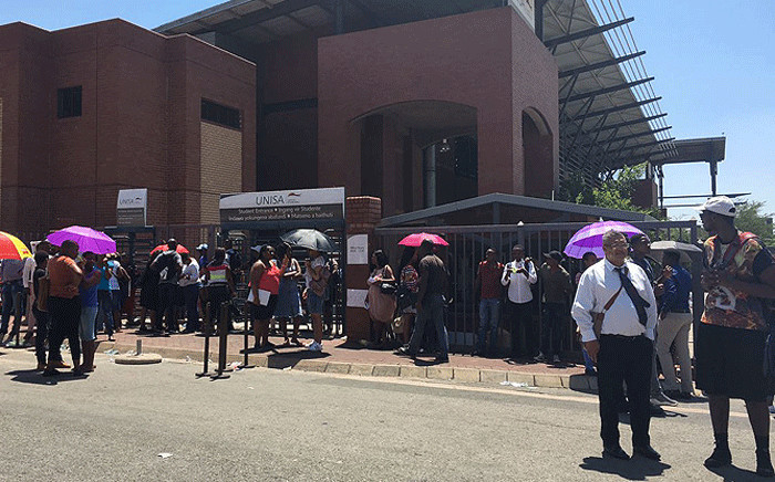 People seen outside Unisa's Sunnyside campus where protests took place, on 15 January 2018. Picture: Ihsaan Haffajee/EWN.