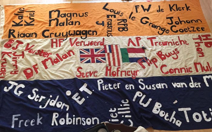 FILE: The old South African flag with the names of people that activist Johan Pienaar says were the architects and enablers of apartheid. Picture: @JohanPienaar/Twitter.