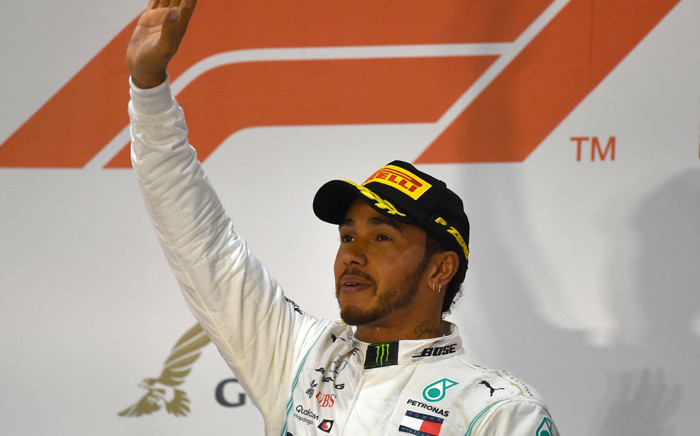 FILE: Mercedes' British driver Lewis Hamilton (C) celebrates on the podium after winning the Formula One Bahrain Grand Prix. Picture: AFP