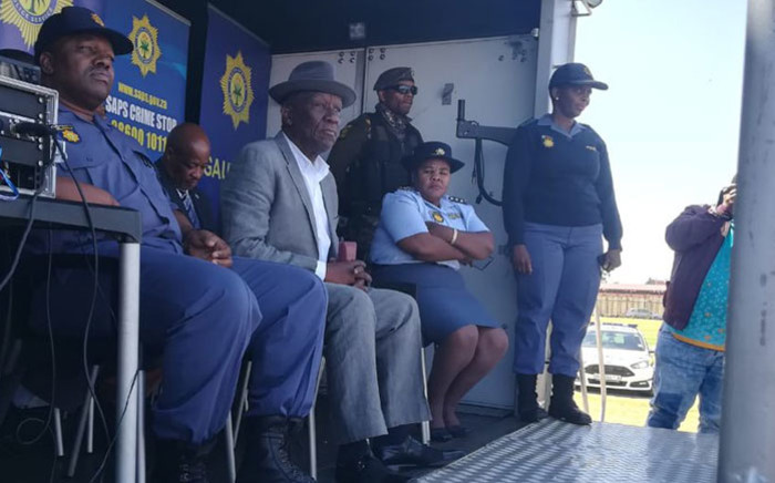 Police Minister Bheki Cele watches a parade by members of a tactical police unit at the Westbury sports ground on 4 October 2018. Picture: @SAPoliceService/Twitter