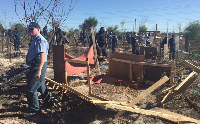 FILE: Law enforcement on Wednesday completely destroyed all the structures built by Khayelitsha residents who illegally invaded a piece of land in the township. Picture: Thomas Holder/EWN. 