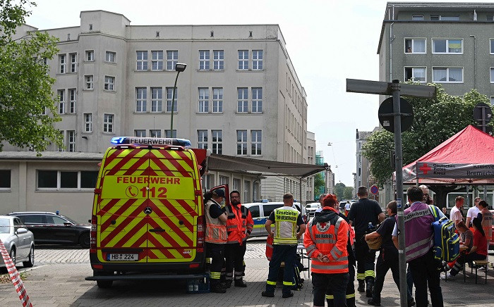Rescues services and police are seen in front of the building of the Lloyd Gymnasium, a secondary school in Bremerhaven, northern Germany on May 19, 2022, after shots were fired at the school. Picture: Sina Schuldt / DPA / AFP