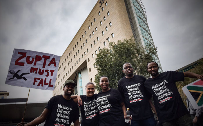 Anti-President Jacob Zuma protesters march through Sandton central holding anti-Zupta placards. Picture: Thomas Holder/EWN.