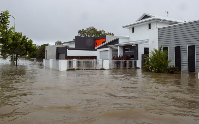 Houses sit in Townsville's floodwaters on 4 February 2019, as the recent downpour in Australia's tropical north has seen some areas get a year's worth of rainfall in a week. Picture: AFP