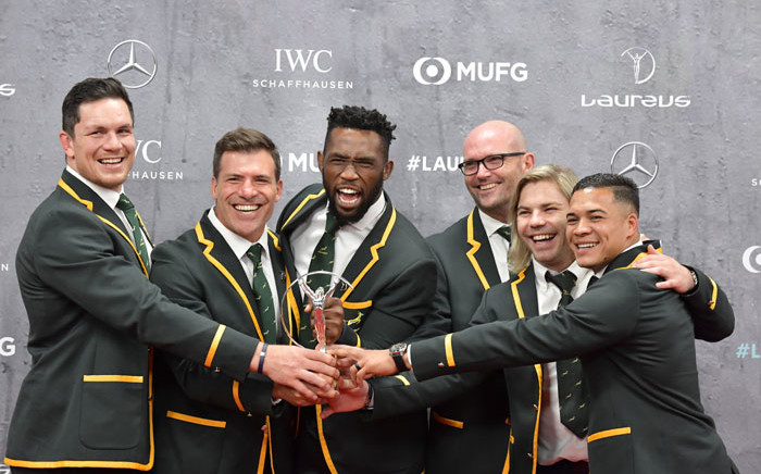 Members of South Africa's men's national rugby team, the Springboks, pose on the red carpet with their Team of the year award at the 2020 Laureus World Sports Awards ceremony in Berlin on 17 February 2020. Picture: AFP