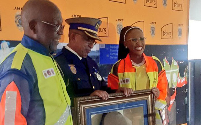 Chief Superintendent Wayne Minnaar (centre) retired from the JMPD after 41 years of service. Picture: @JoburgMPD/Twitter