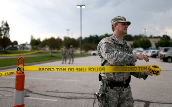 Missouri National Guard troops are deployed to provide protection for a police command center on 19 August 2014 in Ferguson, Missouri. Picture:AFP.