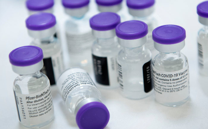 In this file photo taken on 30 December 2020, vials of undiluted Pfizer COVID-19 vaccine are prepared to administer to staff and residents at the Goodwin House Bailey's Crossroads, a senior living community in Falls Church, Virginia. Picture: Brendan Smialowski/AFP