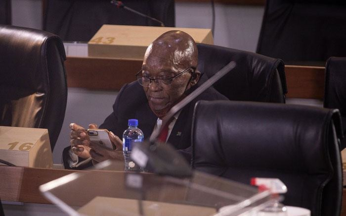 Former President Jacob Zuma checks his phone while at the state capture inquiry in Johannesburg on 17 November 2020. Picture: Abigail Javier/EWN