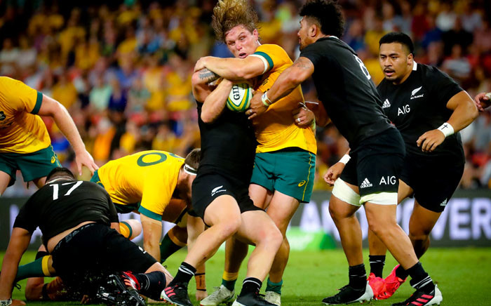 New Zealand's Ardie Savea (R) tackles Australia's Michael Hooper during the Tri-Nations and Bledisloe Cup rugby match in Brisbane on 7 November 2020. Picture: AFP