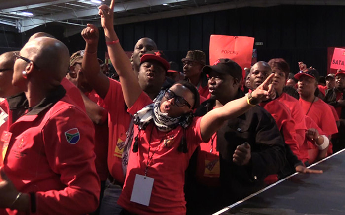 Cosatu members sing during the opening day of the union federation's two-day Special National Congress in Midrand. Picture: Vumani Mkhize/EWN.