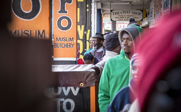 FILE: Pensioners queue outside of a supermarket in Mitchells Plain on the 1st of the month to collect their SASSA grants. Picture: Thomas Holder/EWN
