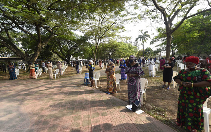 FILE: Worshippers wearing face masks attend a mass outside the St Agnes Catholic Church, Maryland in Lagos, following the reopening of churches and lifting of restrictions on religious gatherings by the government as a precaution to check the spread of COVID-19 on 9 August 2020. Picture: AFP